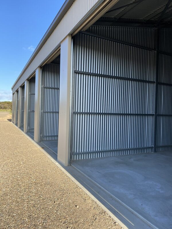 Secured units with dividing walls and roller doors