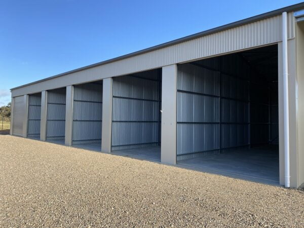 Secured units with dividing walls and roller doors